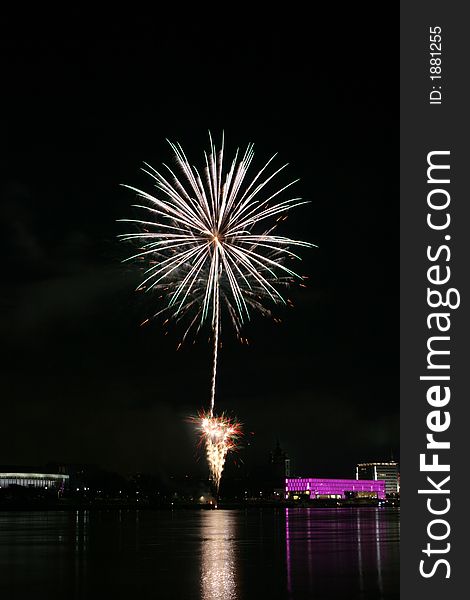 Fireworks in Linz (Austria) at the Danube river with beautiful reflections. On the right side the Brucknerhaus (orchestra house) on the left the Lentos (Museum) with its illuminated walls. Fireworks in Linz (Austria) at the Danube river with beautiful reflections. On the right side the Brucknerhaus (orchestra house) on the left the Lentos (Museum) with its illuminated walls.