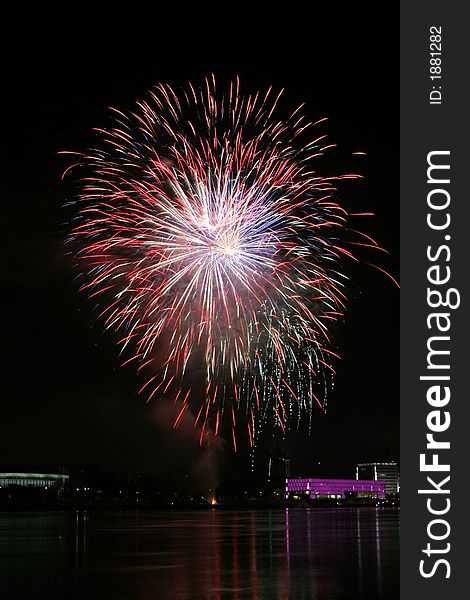 Fireworks in Linz (Austria) at the Danube river with beautiful reflections. On the right side the Brucknerhaus (orchestra house) on the left the Lentos (Museum) with its illuminated walls. Fireworks in Linz (Austria) at the Danube river with beautiful reflections. On the right side the Brucknerhaus (orchestra house) on the left the Lentos (Museum) with its illuminated walls.