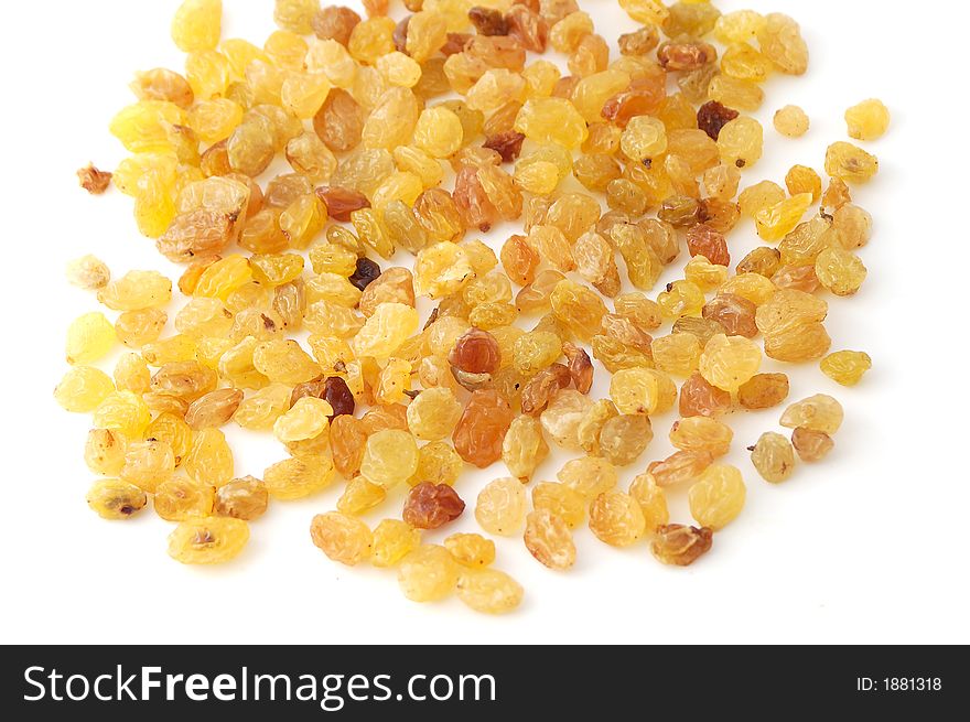 Yellow raisins on the white background