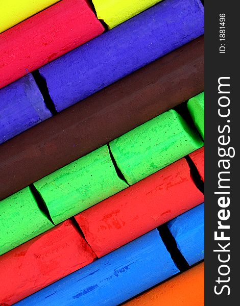 Colorful chalks (red, green, brown, blue, orange)