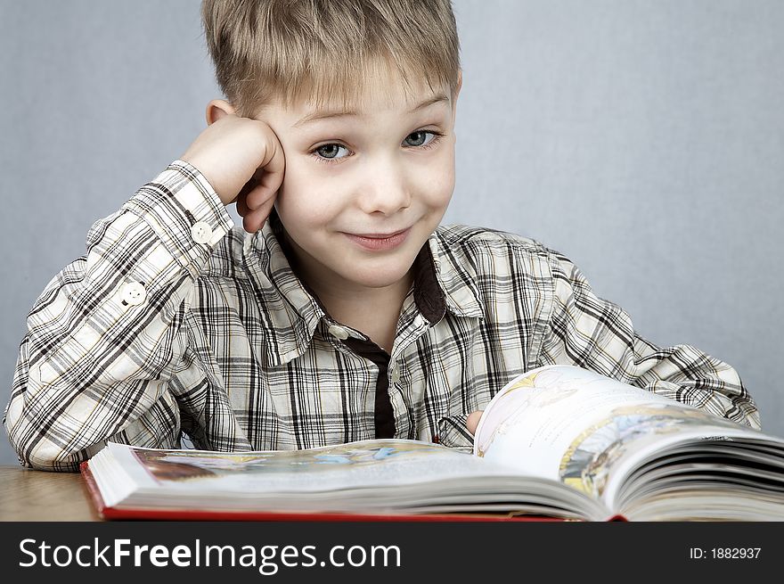 Little smiling boy with big book. Little smiling boy with big book