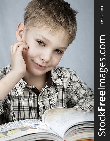 Little smiling boy with big book. Little smiling boy with big book