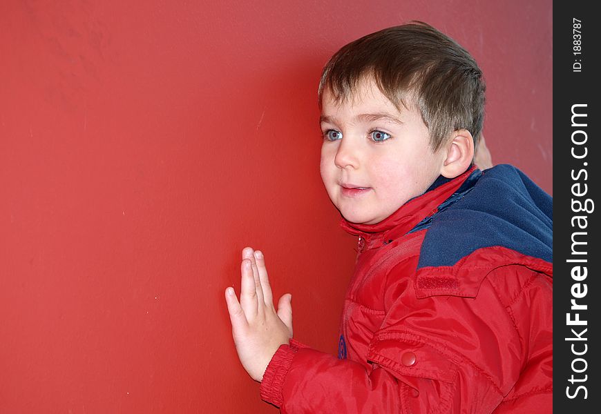 Boy portrait of red isolated background