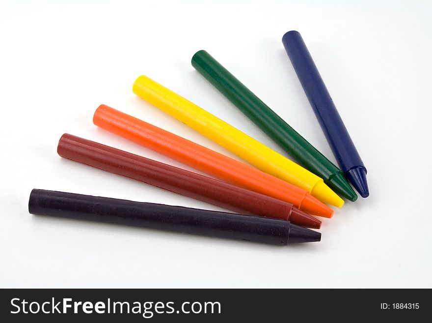 Six colorful crayons on a white background. Six colorful crayons on a white background