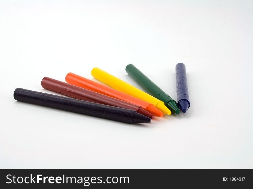 Six colorful crayons on a white background. Six colorful crayons on a white background