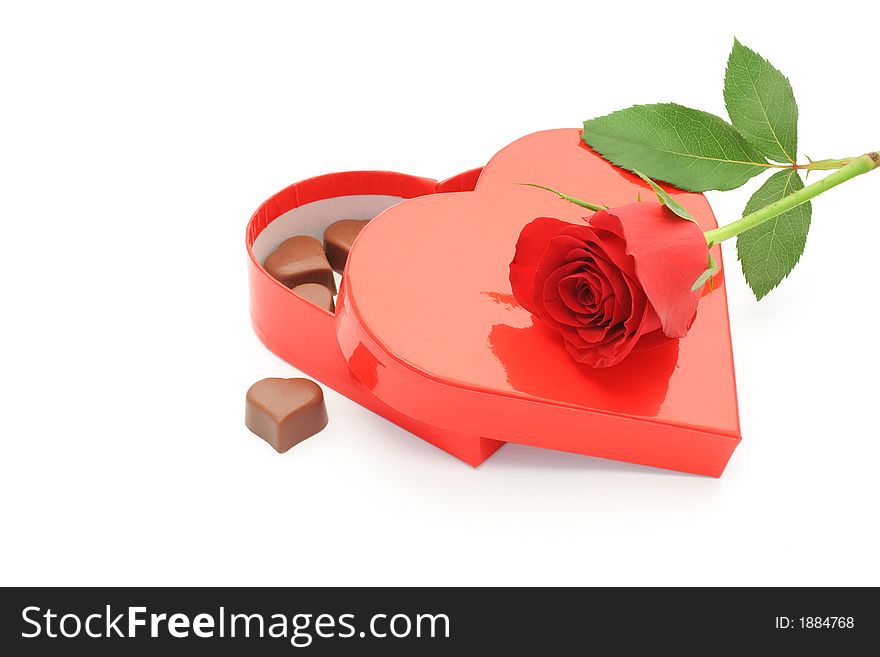 Chocolate box and red rose - isolated