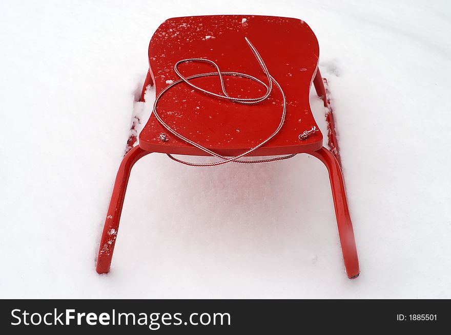 Red sledge in the fresh snow