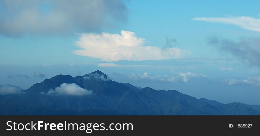 Clouds over a mountain