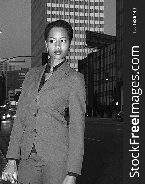 African American business woman returning home from office. African American business woman returning home from office.