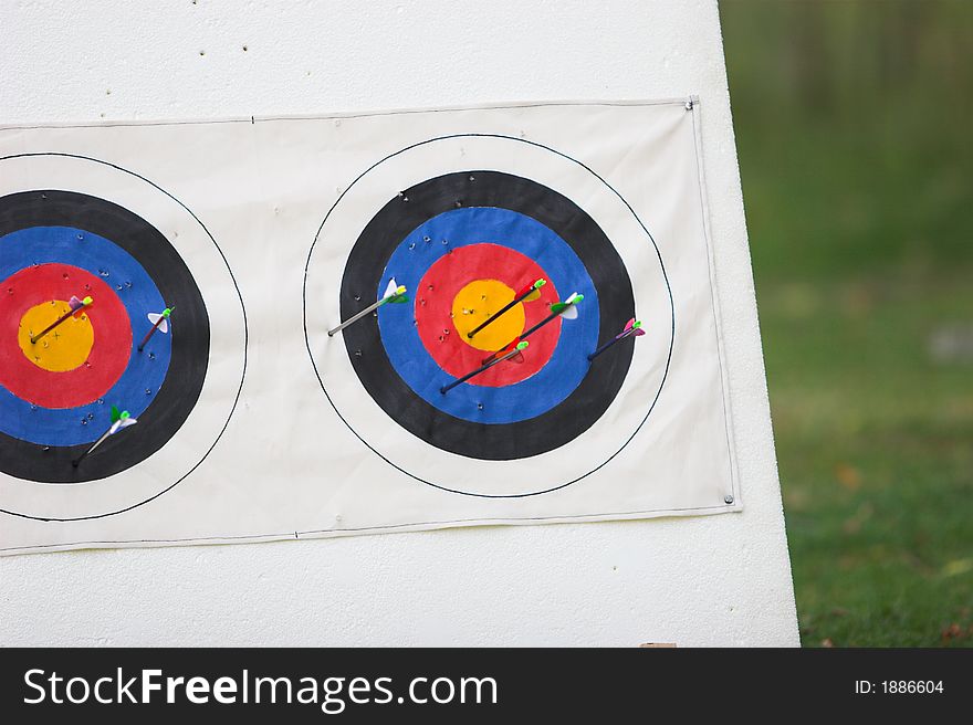 Archery targets with arrows portruding, vivid colours. Archery targets with arrows portruding, vivid colours