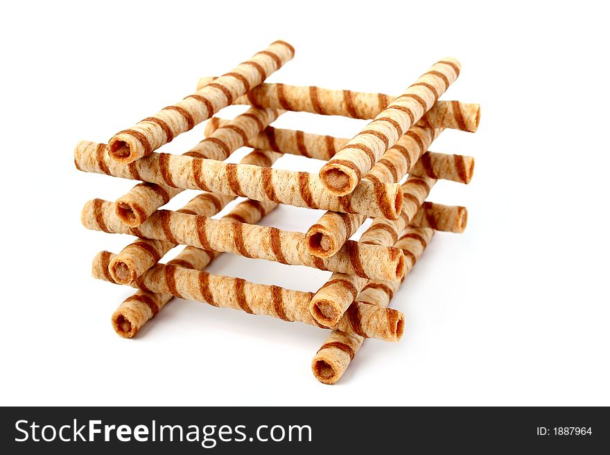 Heap of striped wafer tubules with the chocolate cream, isolated, (look similar images in my portfolio)