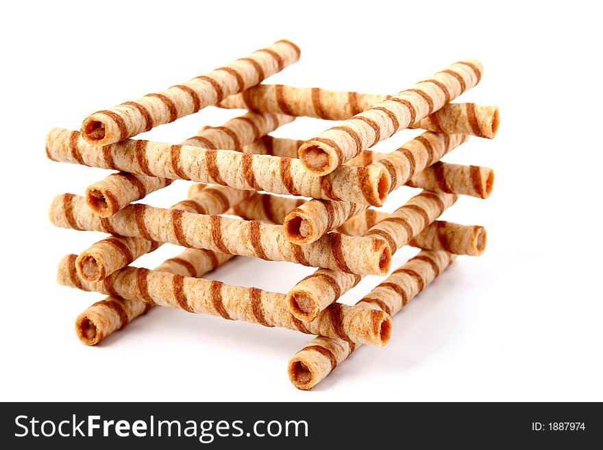 Heap of striped wafer tubules with the chocolate cream, isolated, (look similar images in my portfolio)