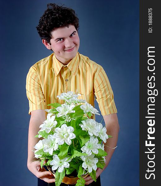 Young boy with white flowers. Young boy with white flowers