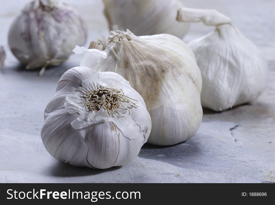 Garlic cloves on a slate background