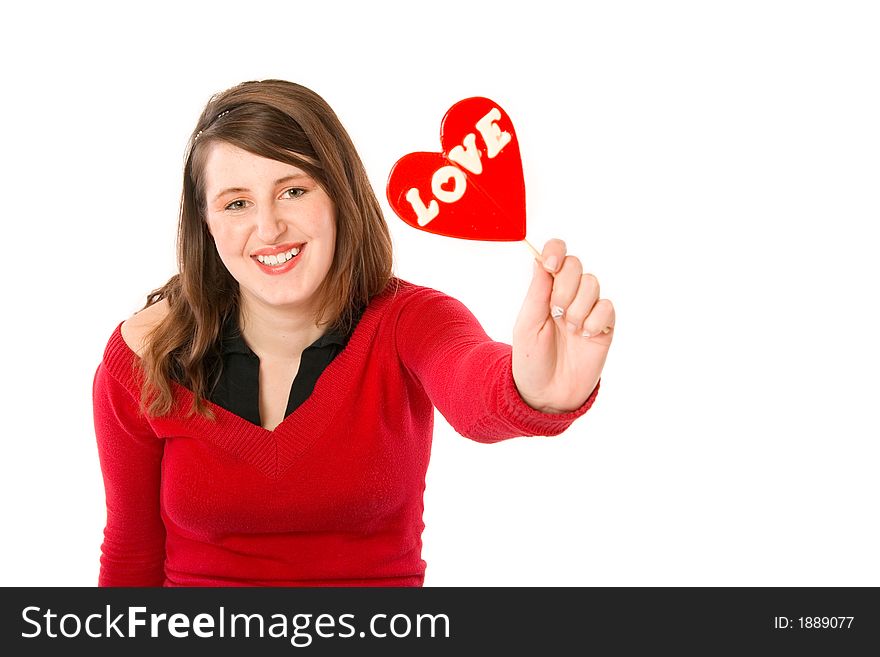 A girl showing her lollipop with a text 'love' on it. A girl showing her lollipop with a text 'love' on it.