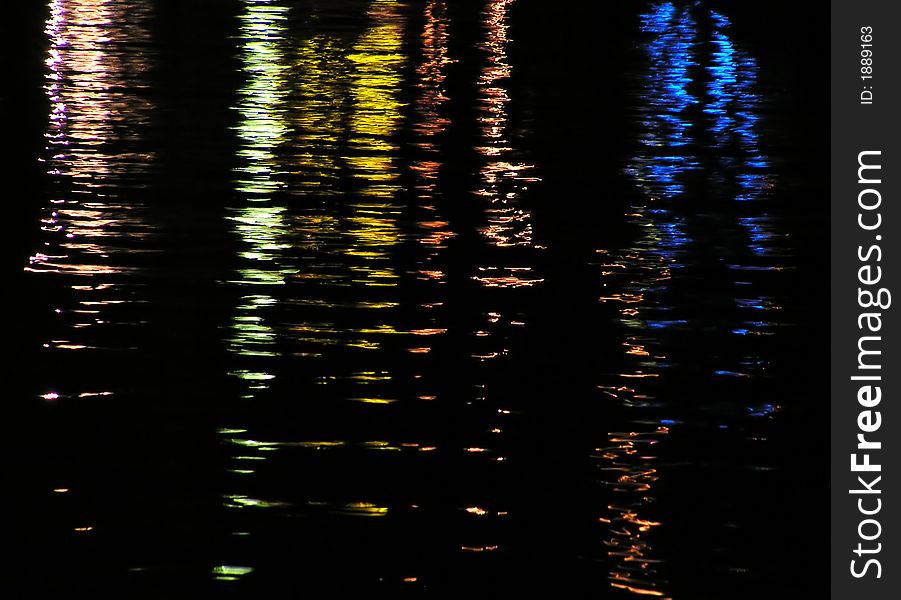 Color reflections in the sea at night.