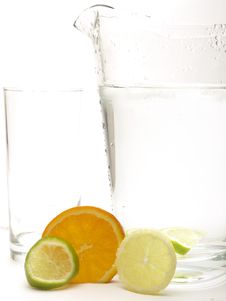 Lemon, Lime And Orange With A Jug And A Glass Stock Photography Lemon, Lime And Orange With A Jug And A Glass Stock Photography