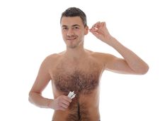 Handsome Young Man Cleaning Ears With Cotton Stick Royalty Free Stock Photo