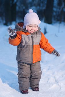 Adorable Baby Try To Remove Snow From Mittens Stock Photography Adorable Baby Try To Remove Snow From Mittens Stock Photography
