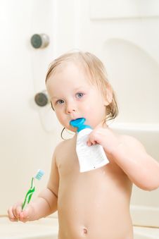 Adorable Baby Brushing Teeth In Shower Royalty Free Stock Photography