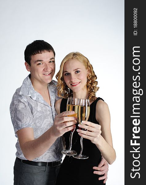 Couple of young girl and man drink champagne