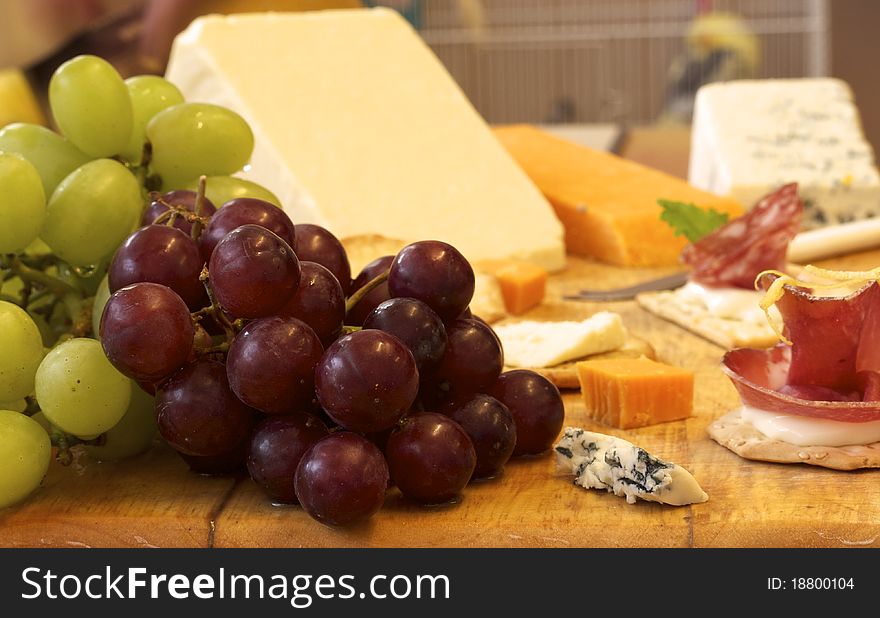 Selection Of Cheese And Crackers With Grapes