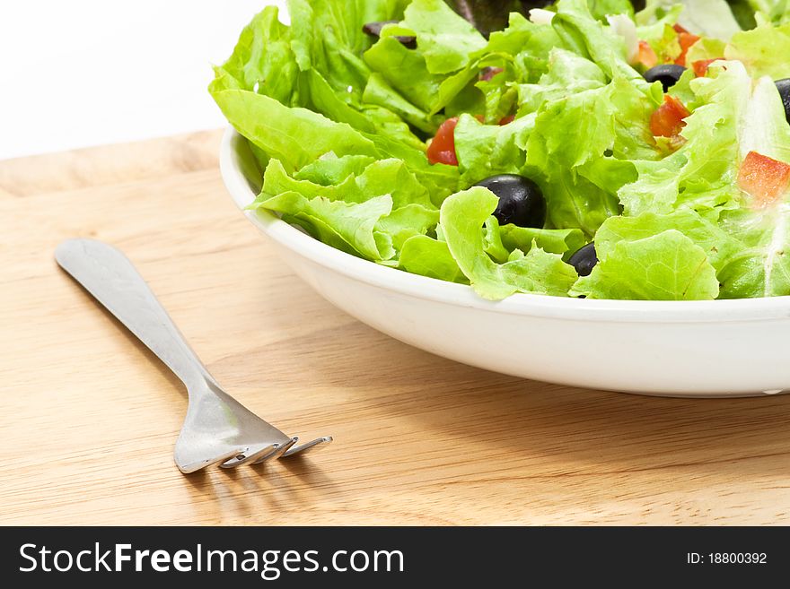 Greek salad style with fork. Greek salad style with fork