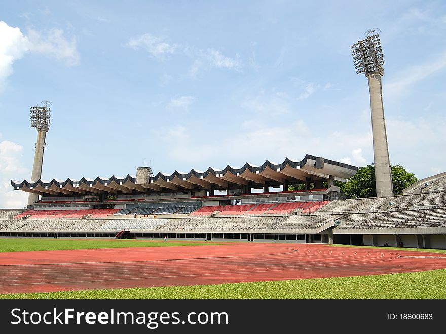 Small Sport Stadium With View Of Grandstand And Floodlights