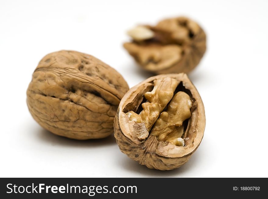 Walnut shell cracked on white background