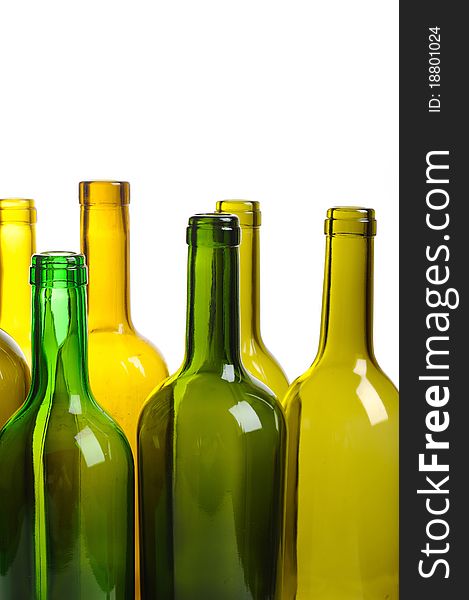 Many empty green wine bottles isolated on white background