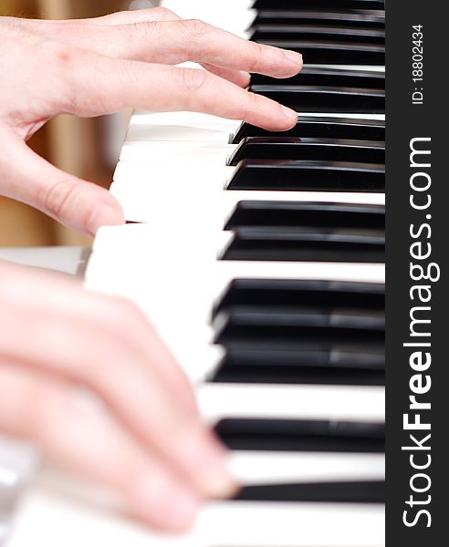 Men playing piano close up. Men playing piano close up