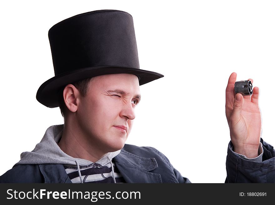 Portrait of the handsome man in a top-hat with a spare part in hand