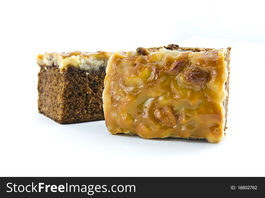 Piece of toffee cake isolated on white background