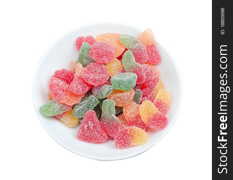 Sugar coated gumdrops in a bowl isolated on a white background