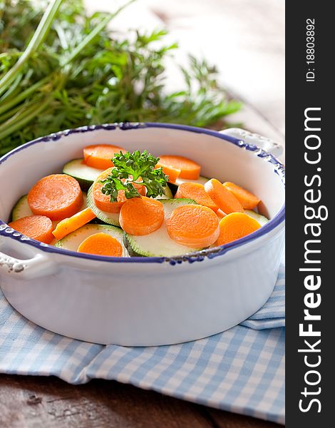 Sliced carrots and zucchini in a bowl