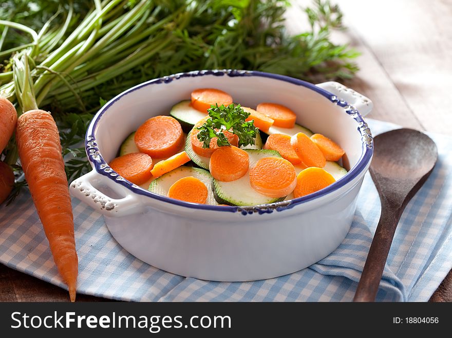 Sliced carrots and zucchini in a pot