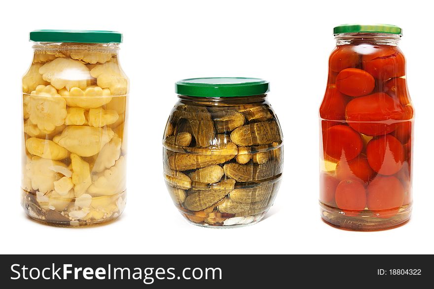 Collage three jars of pickled vegetables isolated on a white background. The image is composed of several photographs.