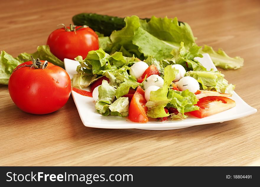 Salad with mozzarella , tomatoes, lettuce. Salad with mozzarella , tomatoes, lettuce