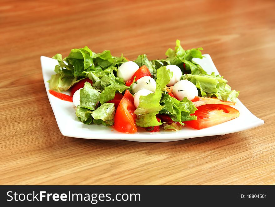 Salad with mozzarella, tomatoes,lettuce. Salad with mozzarella, tomatoes,lettuce