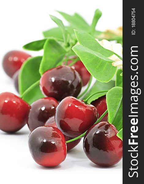 Sweet red cherries with leaves isolated on white background. Sweet red cherries with leaves isolated on white background