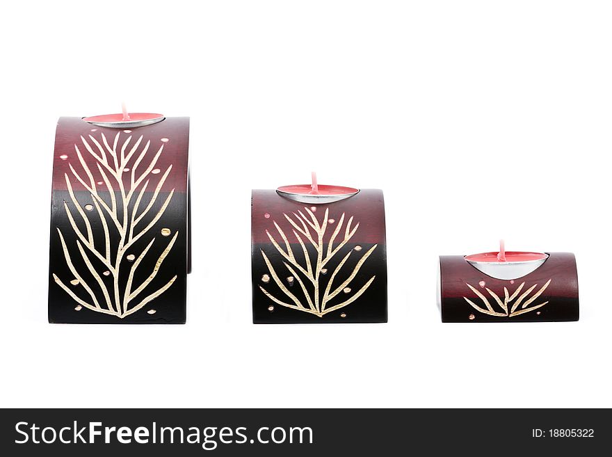 Ornamental decorated candle holders with small candles isolated. Ornamental decorated candle holders with small candles isolated