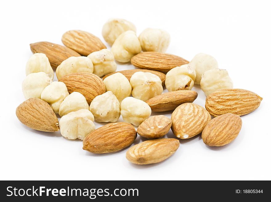 Mixed nuts closeup view on white background