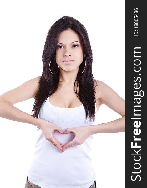 Smiling woman making heart sign over heart. Smiling woman making heart sign over heart