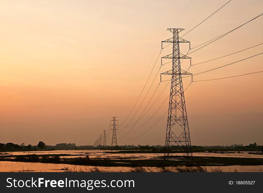 High voltage poles in sunset