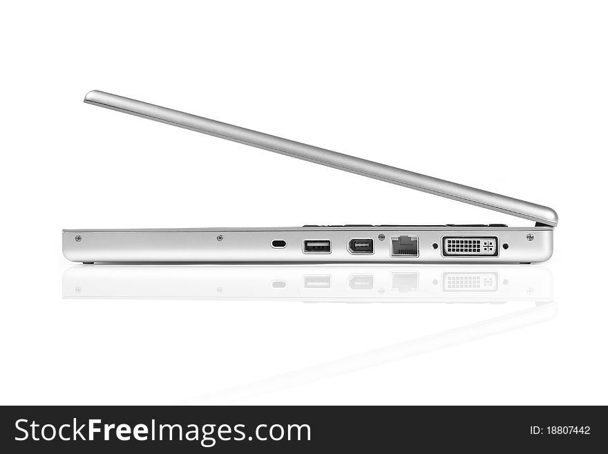 Laptop computer, side view. Isolated with reflection on white