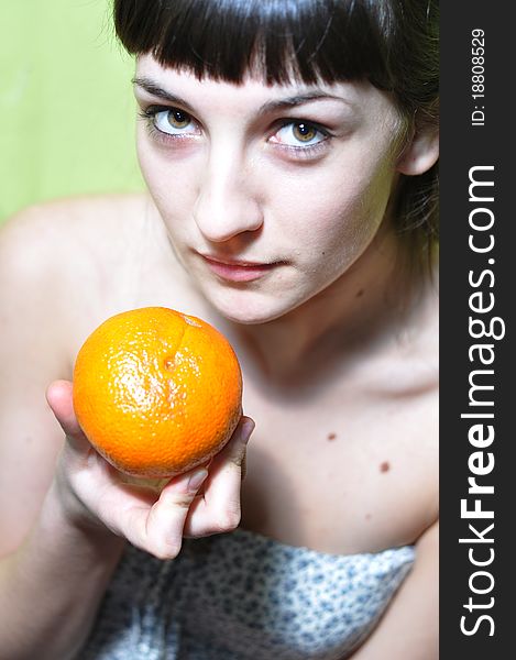 Picture of young girl holding an orange. Picture of young girl holding an orange