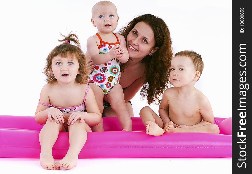 Mother With Three Children In Swimsuits