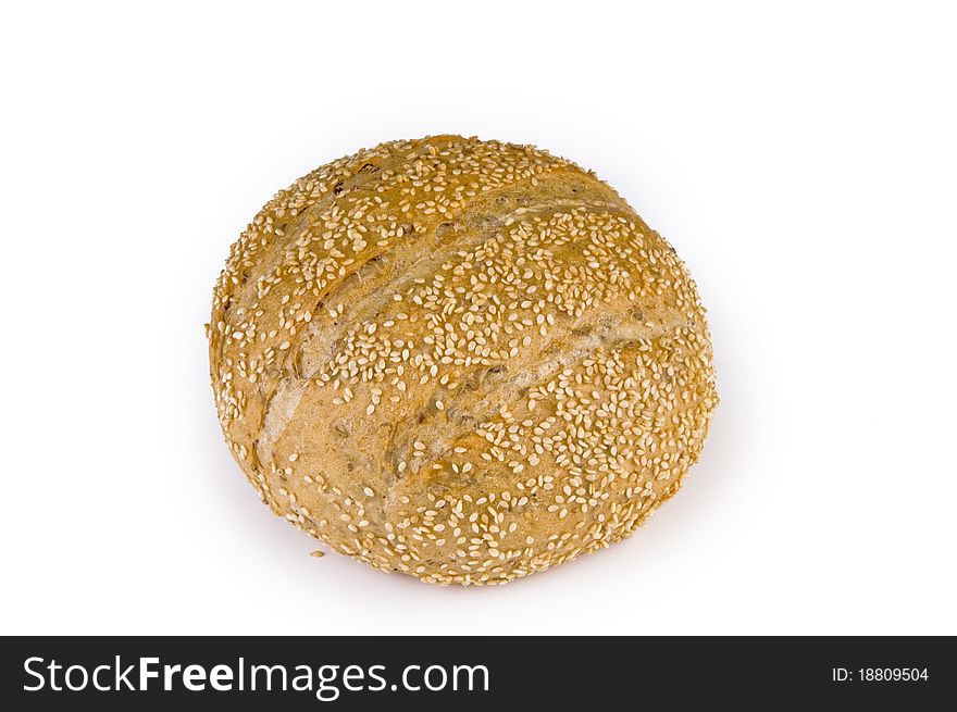 Bread sprinkled with sesame seeds on a white background. Bread sprinkled with sesame seeds on a white background