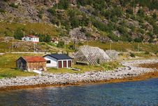 Norwegian Shore With Wooden Rack For Drying Cod Royalty Free Stock Photo Norwegian Shore With Wooden Rack For Drying Cod Royalty Free Stock Photo