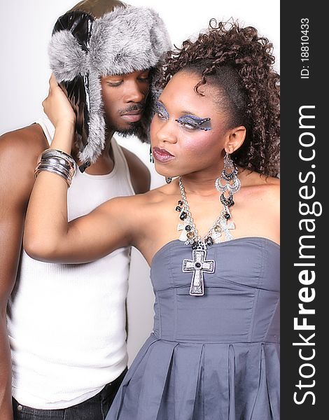 A man and woman standing against a white background. A man and woman standing against a white background